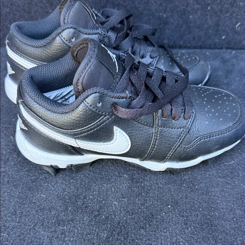 Nike Black and White Youth Baseball Cleats. Like new. Worn once - too small.